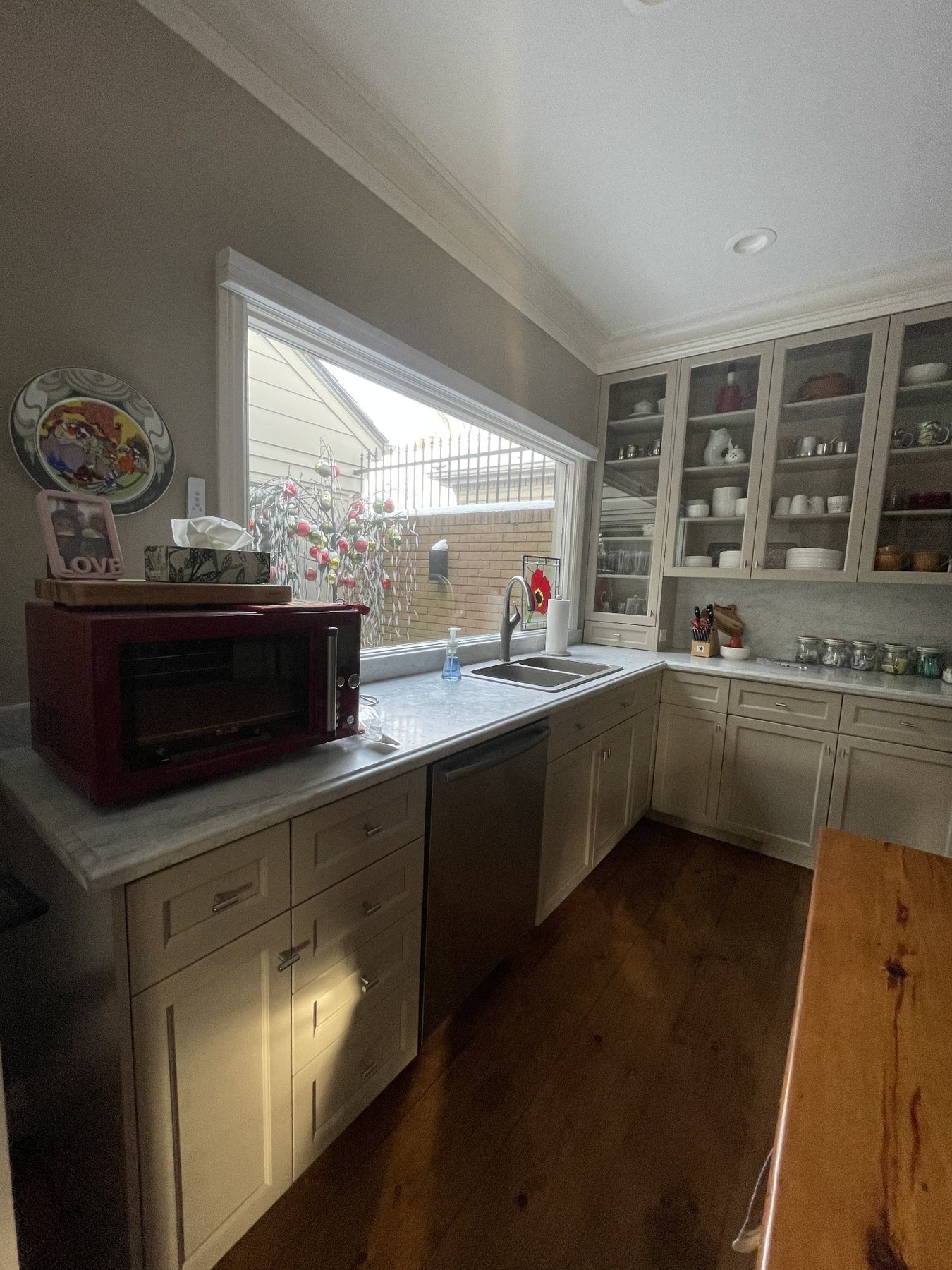 Full kitchen cabinet spray refinishing project with light-coloured cabinets