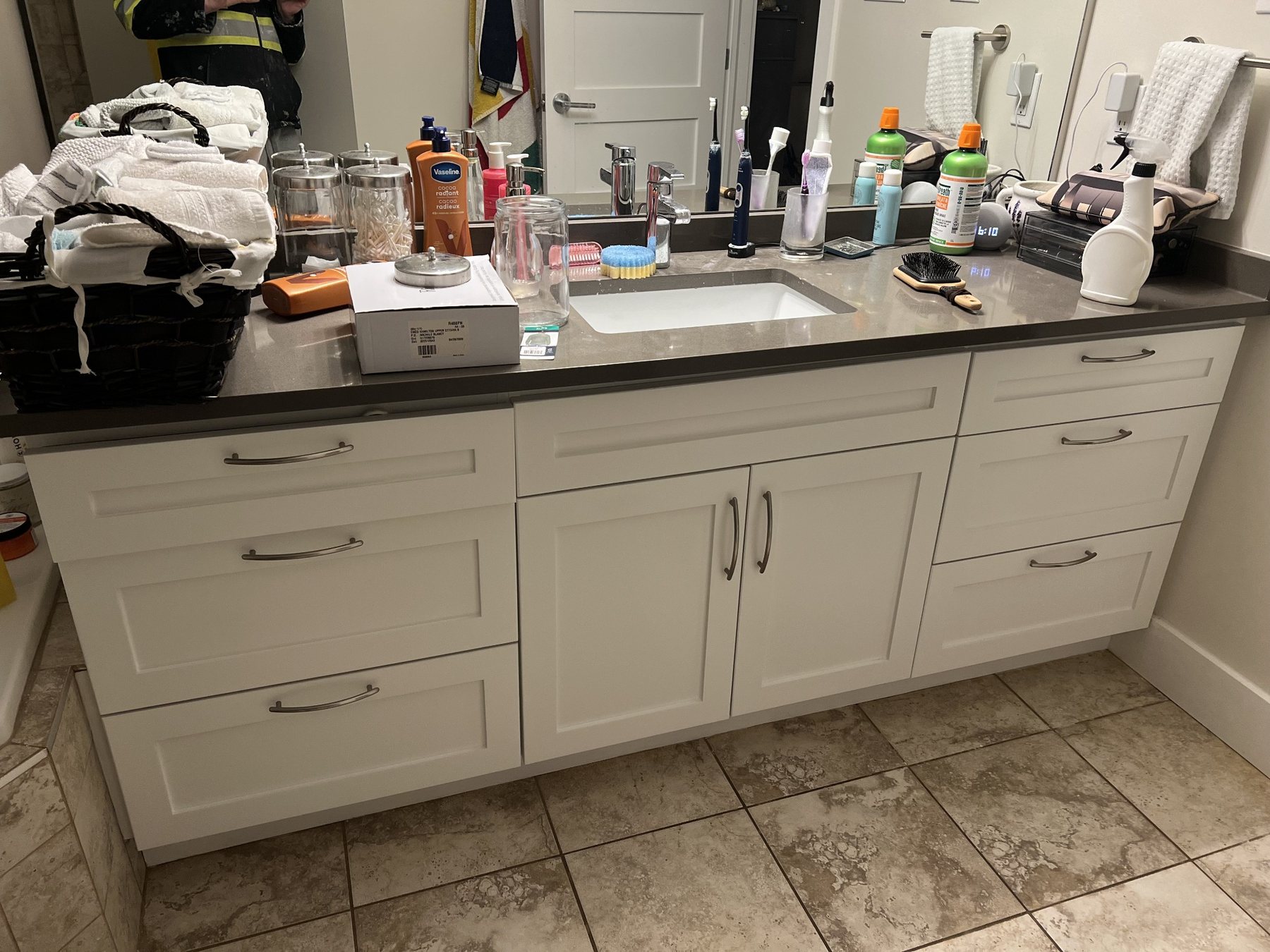 Cabinet installation and refinishing preparation before countertops and final finishes